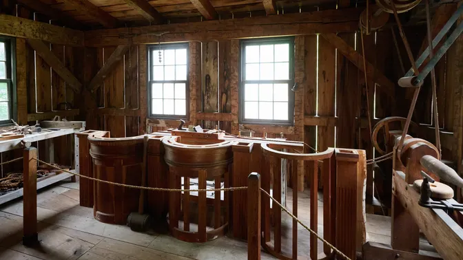Interior of workshop with unfinished pulpit under construction.
