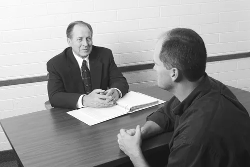 bishop interviewing man