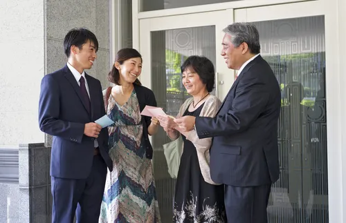 standing in front of temple doors