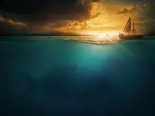 Jonah being cast from a boat into the sea, where the shadow of a large fish is barely visible