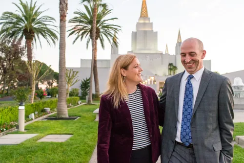 couple standing in front of temple