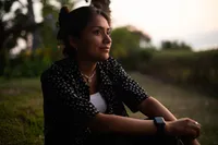 A young woman ponders