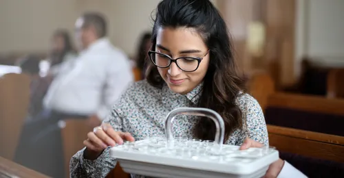 young woman taking the sacrament