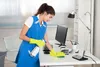 lady cleaning desk