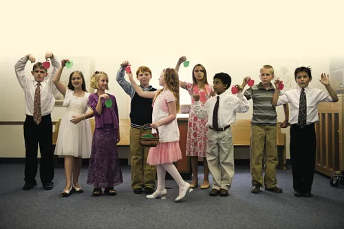 children pretending to pick apples