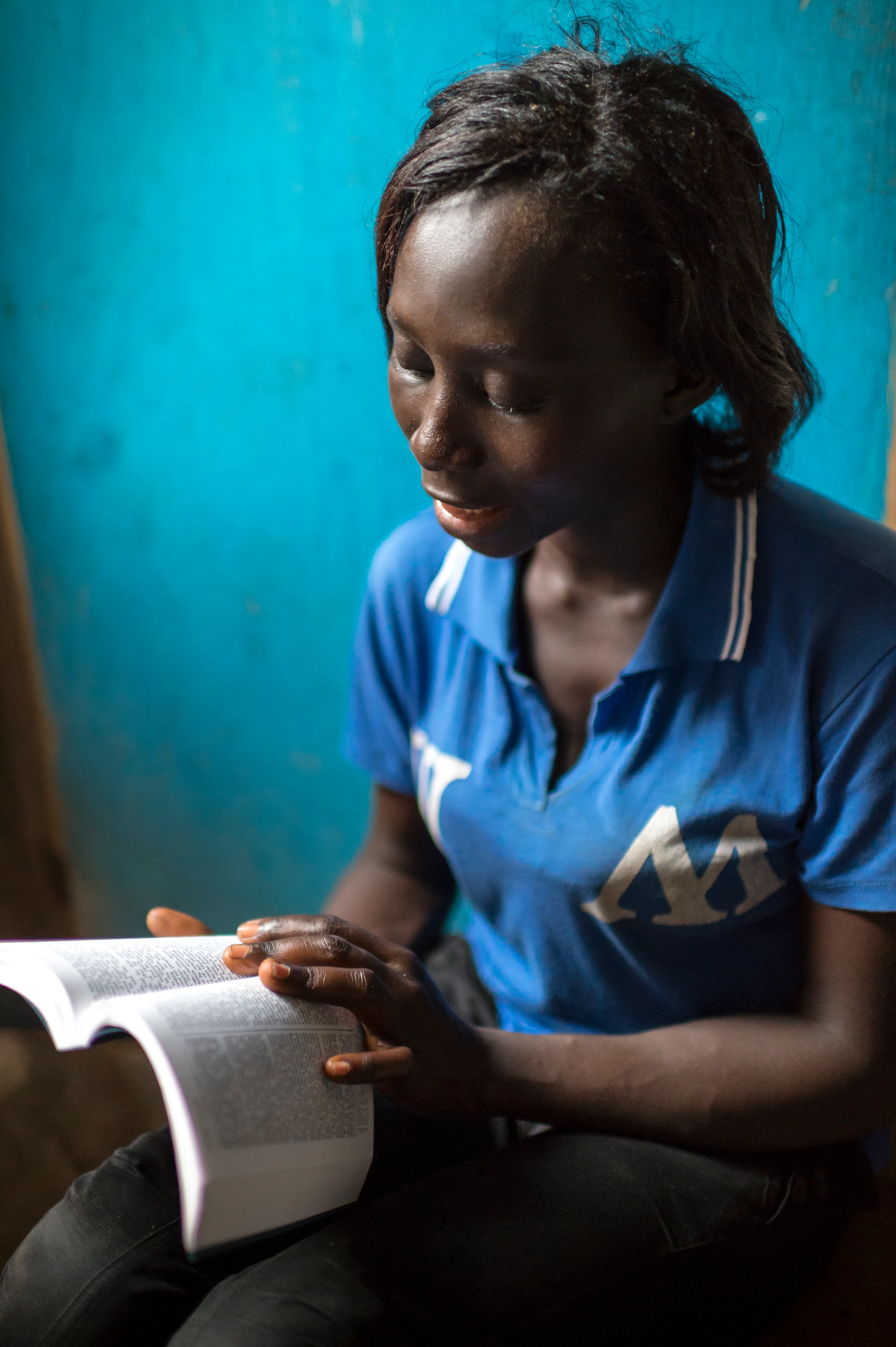 A woman reads the Book of Mormon.