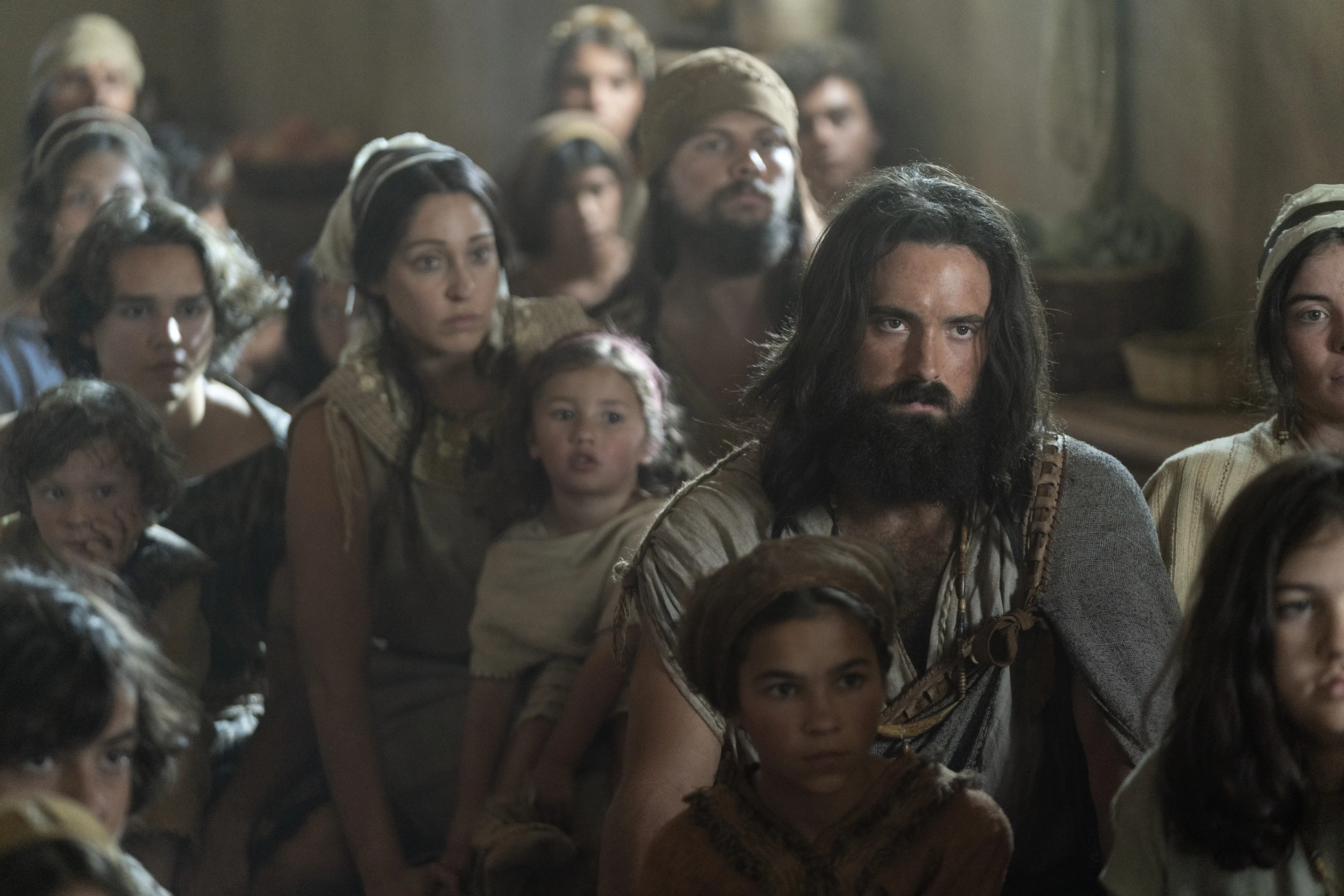 Lehi's family listens as he teaches them.