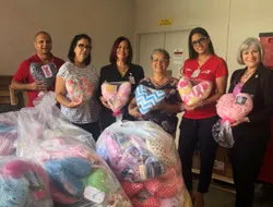 group of people delivering pillows to hospital