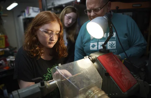 youth and adult working together