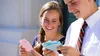 young woman and young man looking at temple cards