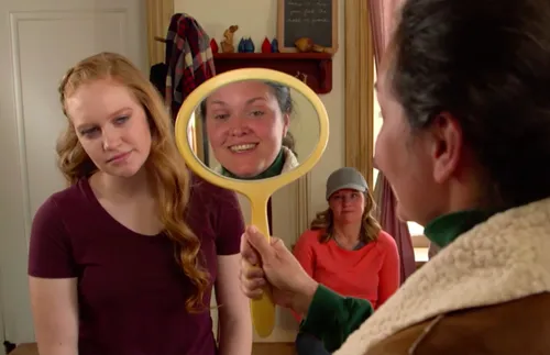 Conversation between a young woman and a leader is difficult when looking into a mirror