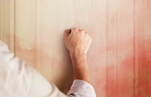 man knocking on a door