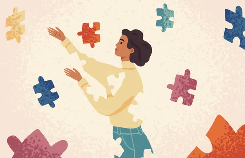 woman looking at puzzle pieces