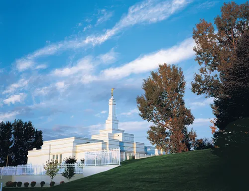 The Bismarck North Dakota Temple, seen beyond a green hill.
