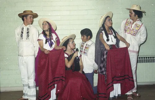 group of people posing in traditional costumes