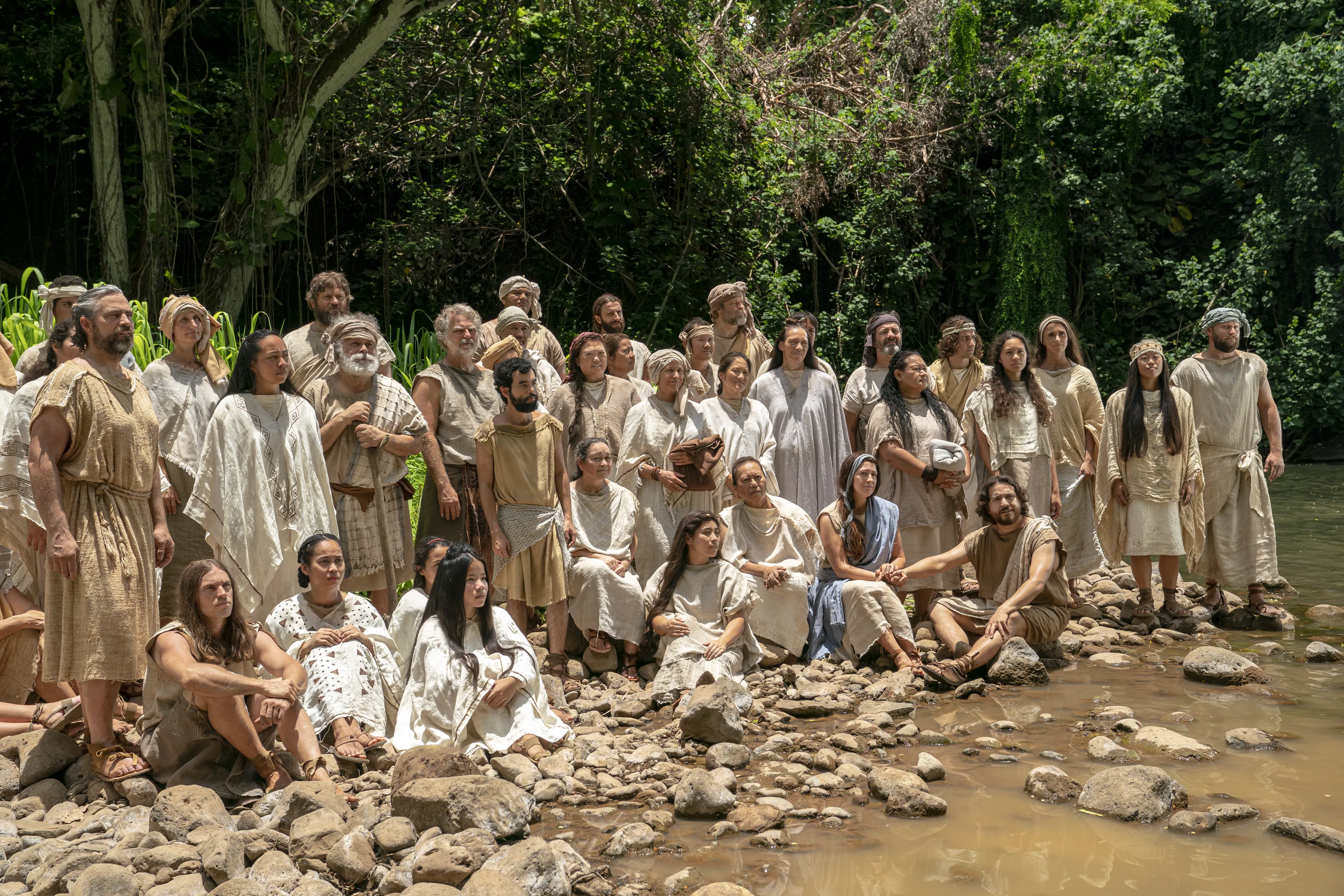 People prepare themselves to be baptized at the Waters of Mormon. They listen to Alma teach and testify.
