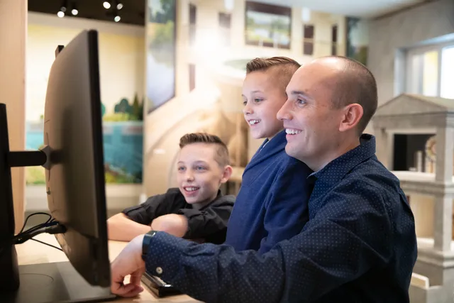 A children's exhibit is set up in the Church History Museum. These images are of areas with interactive elements. A young boy is playing with his father.