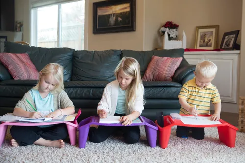Children coloring on mini tables