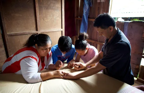 family praying together