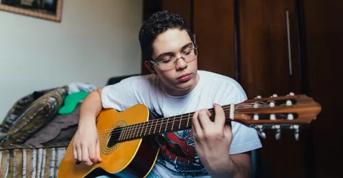 young man playing guitar
