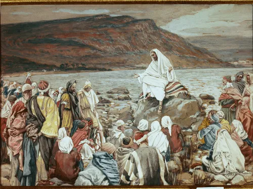 Jesus Christ sitting on a rock on the shores of the sea of Galilee. Numerous people are gathered around Him. The people are listening to Christ preach. (Mark 4:1) (Luke 5:1)