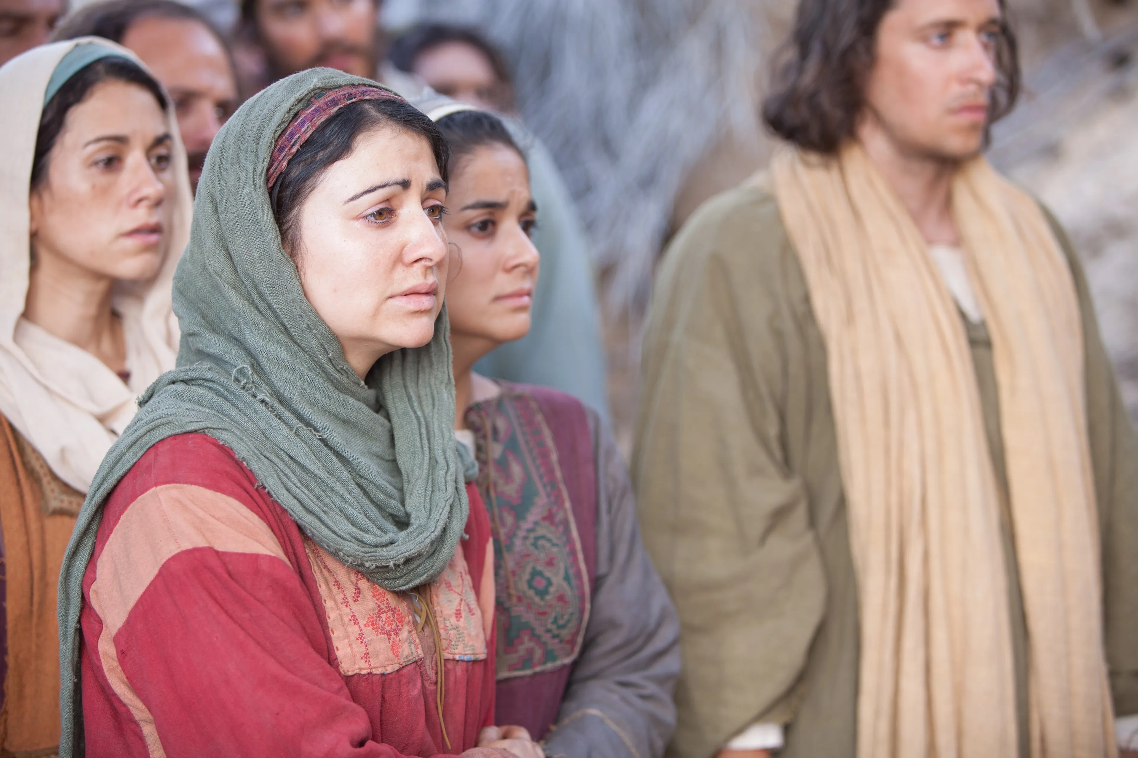Mary and Martha crying at the tomb of Lazarus.