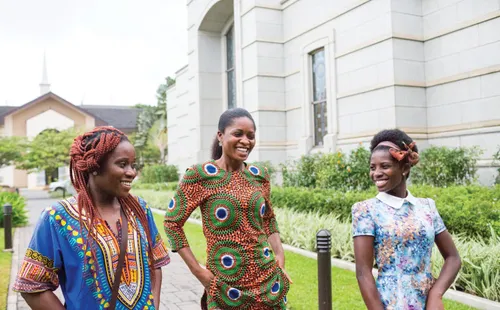 three women walking the grounds of the Accra Ghana Temple