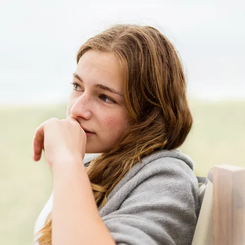 young woman pondering