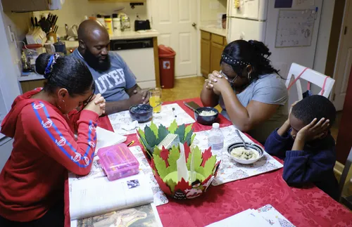 Henderson family praying
