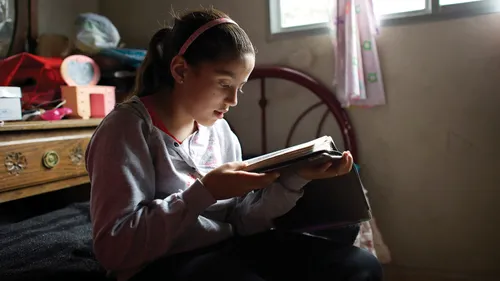 a girl reading the scriptures
