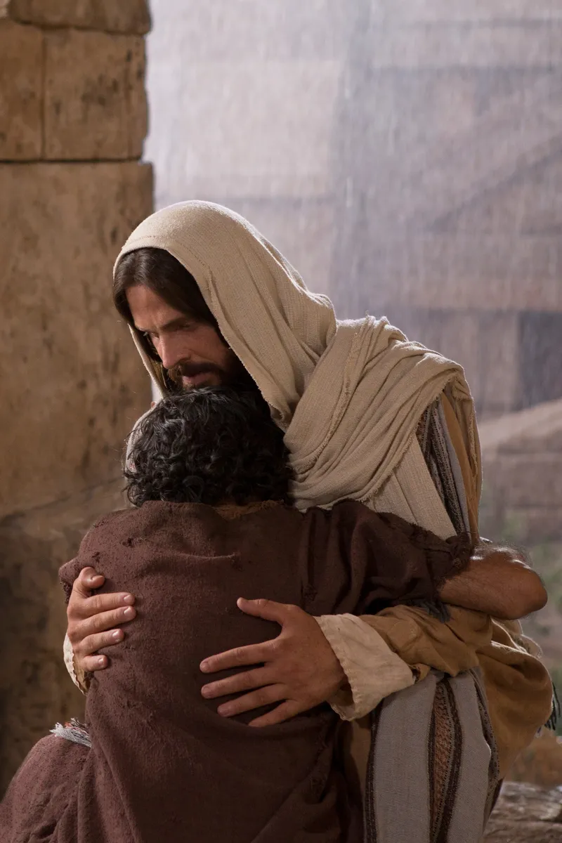 A man hugs Jesus Christ after having his sight restored