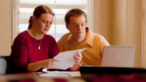 couple looking at papers