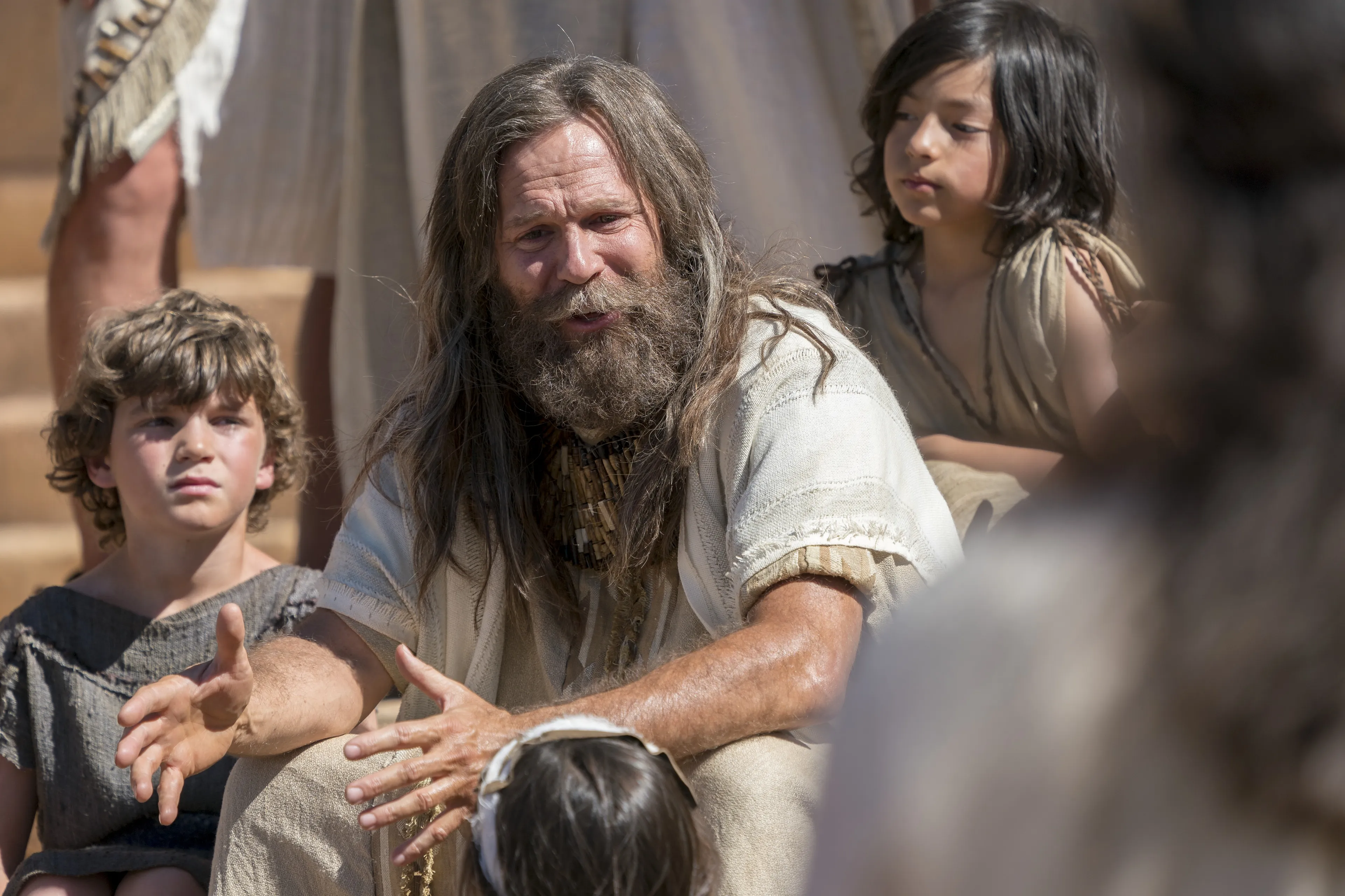 Jacob sits on the steps of the temple as he teaches the Nephites.