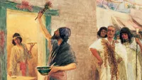 A painting by W. H. Margetson of an Israelite man painting blood over the door of his home in preparation for the Passover, with others watching nearby.