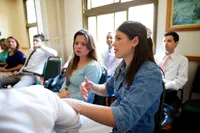 A group of women meet together to discuss the gospel of Jesus Christ