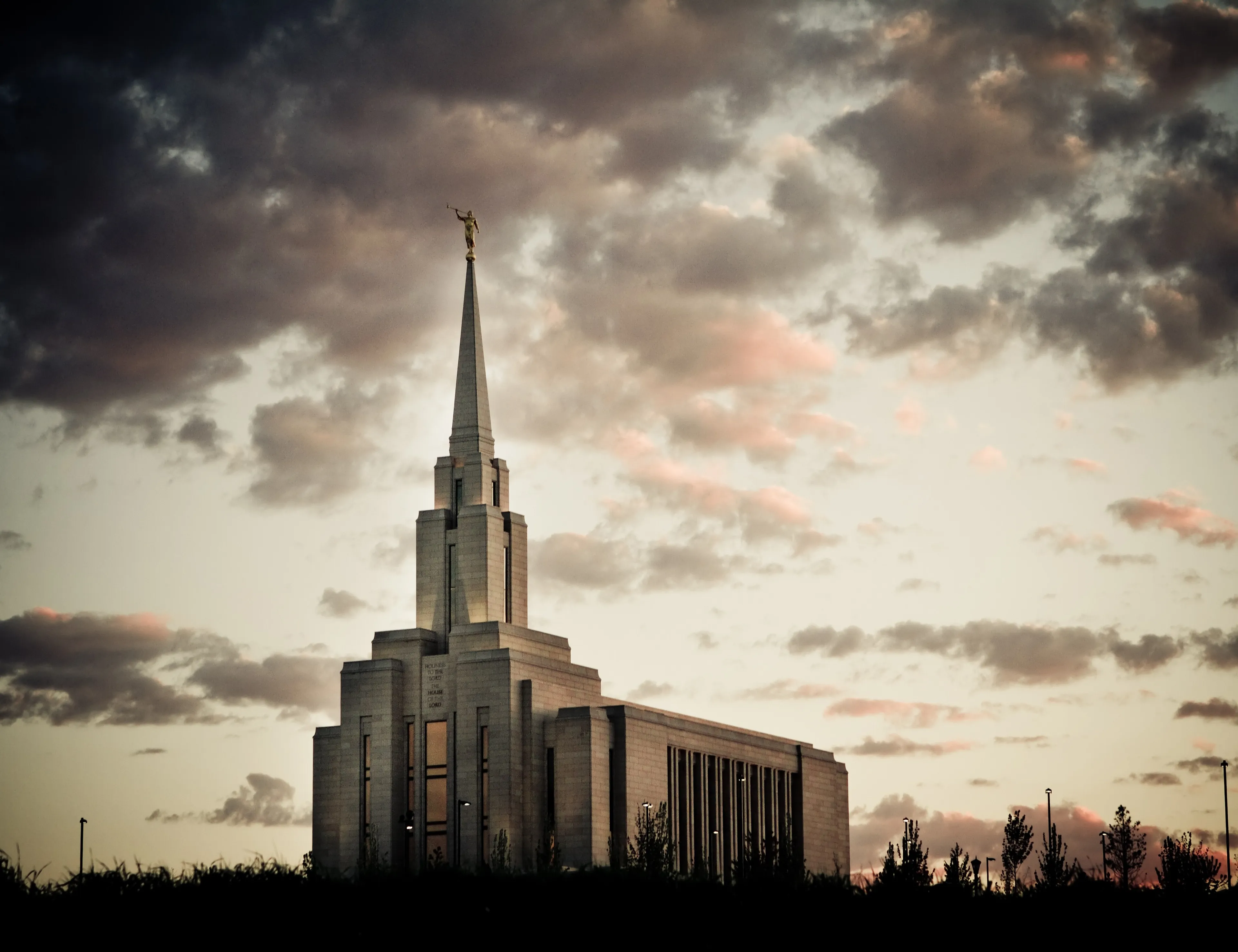The Oquirrh Mountain Utah Temple in the evening, including scenery.