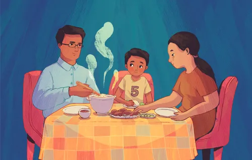 Father, mother, and son eating dinner