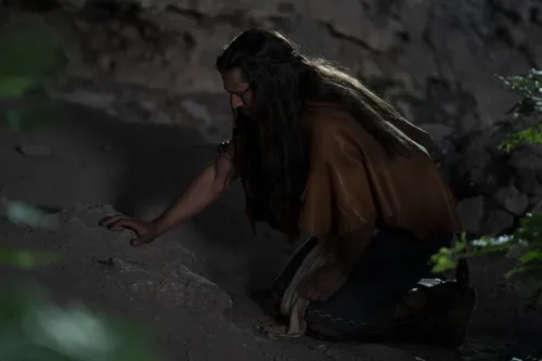 Enos prays at night.