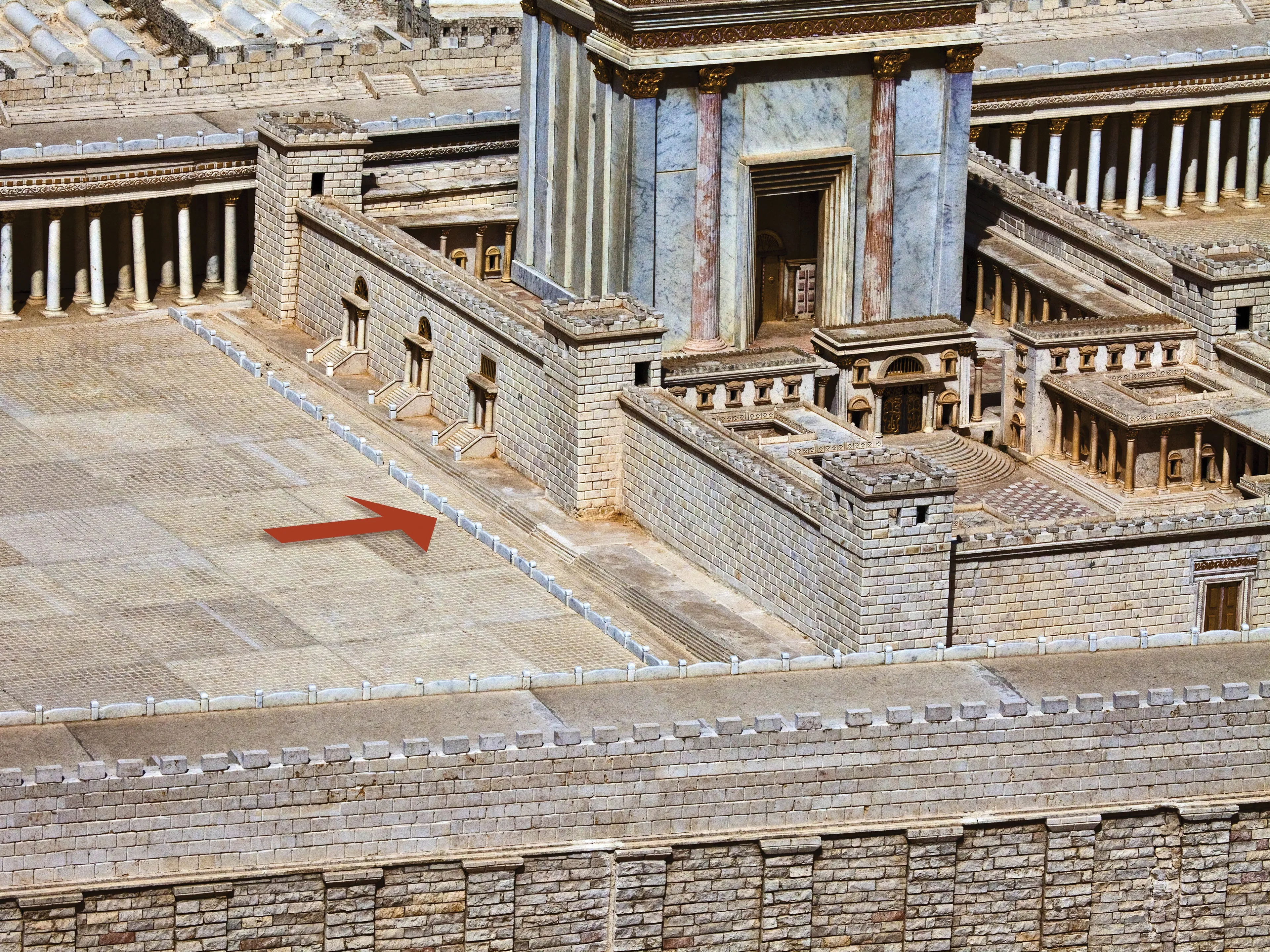 A model of first-century Jerusalem, with the wall of partition around the temple indicated by an arrow.