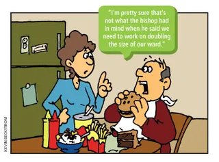 man eating large hamburger meal