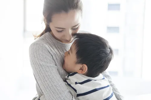 mother hugging her son