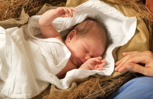 Photograph of baby in manger
