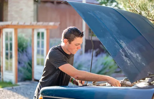 a man working on a car
