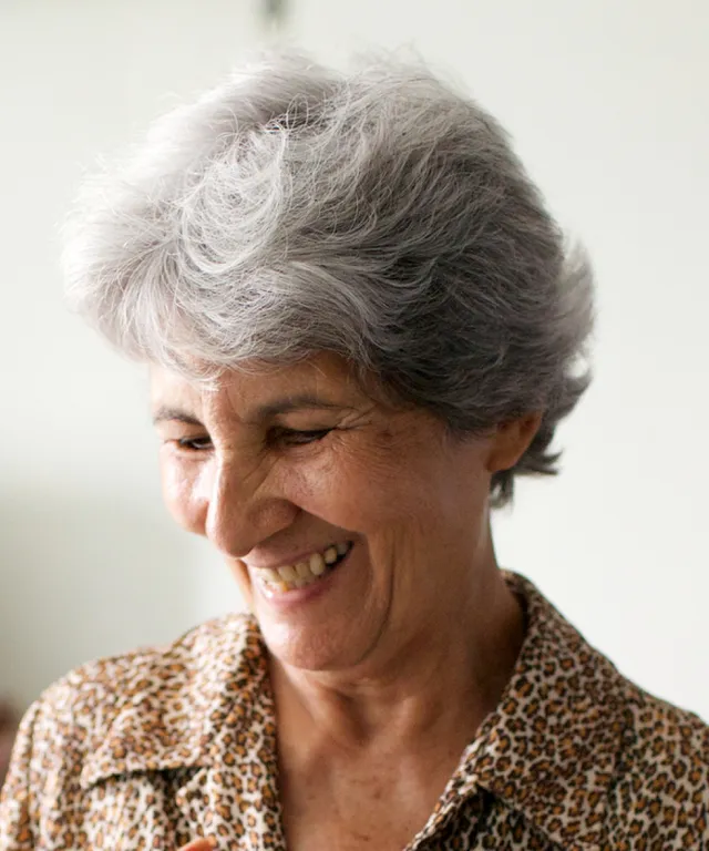 A senior sister missionary in Brazil looks at her name tag.