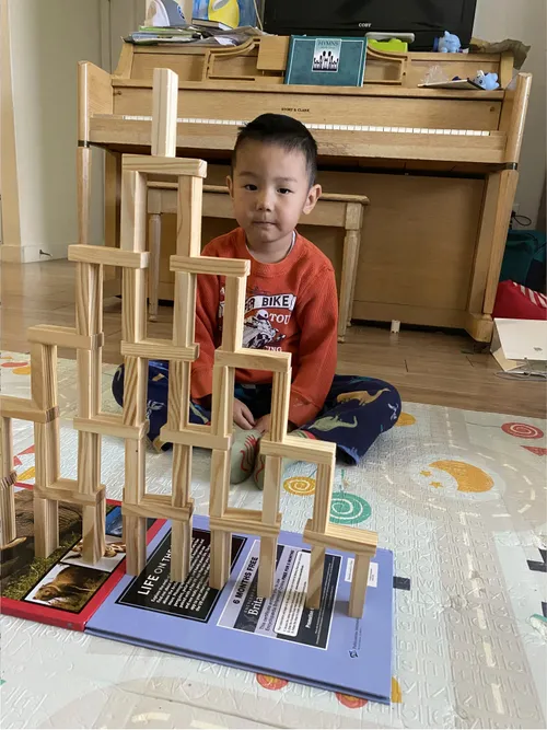 Boy with temple made of blocks