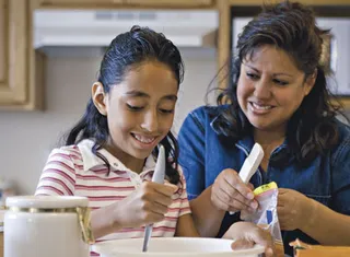 mother and daughter cooking