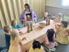 Photo of children sitting at a table learning about Easter