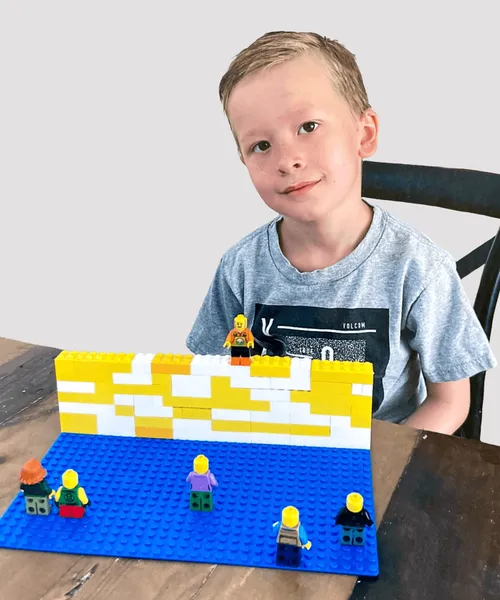 Boy with his display of Samuel on the wall