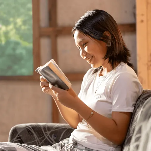 young woman reading scriptures