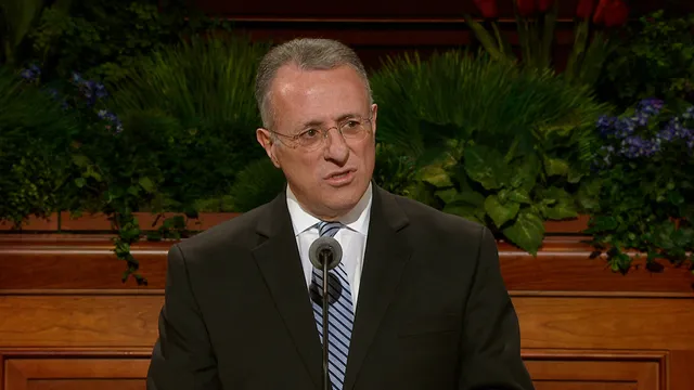 Elder Ulisses Soares speaks during a session of conference.